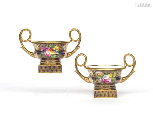 A pair of Spode Krater vases c.1820, the squat forms with high handles and raised on square bases,