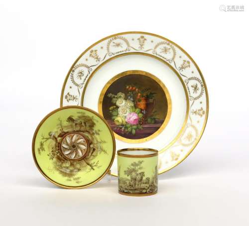 A Paris porcelain plate and a can and saucer 19th century, the plate painted to the well with a
