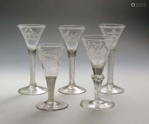 Five Continental wine glasses mid 18th century, three with drawn trumpet bowls variously engraved