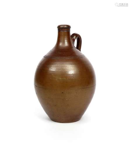A large brown stoneware flagon c.1700, of substantial ovoid form rising to a tapered neck with a