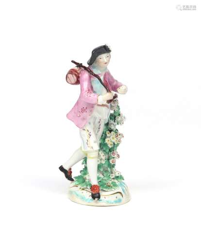 A Derby figure of a haymaker c.1760, carrying a keg on a staff supported on his shoulder, standing