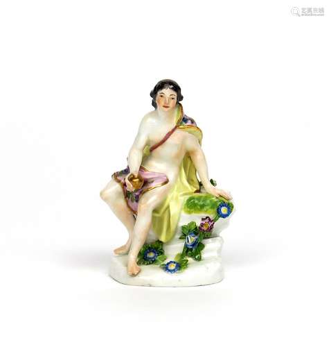 A Meissen figure of Paris mid 18th century, seated on a rocky base and holding the Golden Apple in