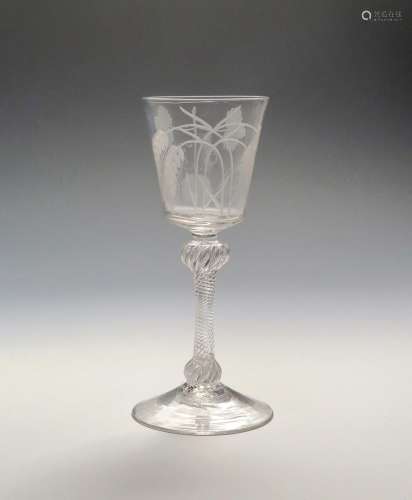 An ale glass c.1760, unusually with a flared bucket bowl engraved with crossed double stems of