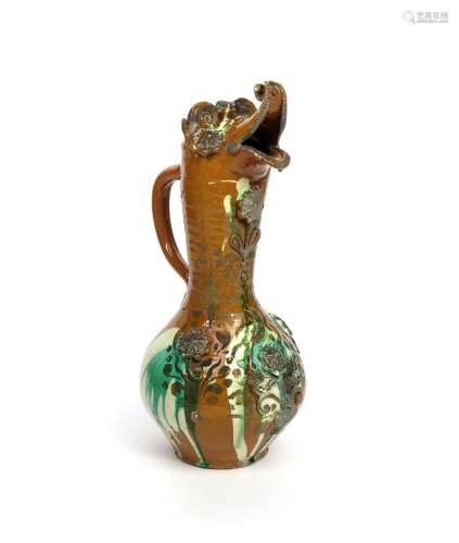 A large Canakkale (Turkey) pottery anthropomorphic ewer 19th century, the rounded body applied