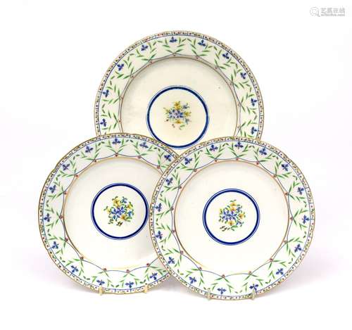 Three English porcelain plates 1st half 19th century, painted with a central floral roundel, the