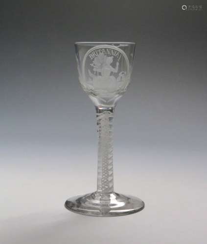 A 'Britannia' wine glass c.1765, the ogee bowl engraved to one side with an oval panel enclosing