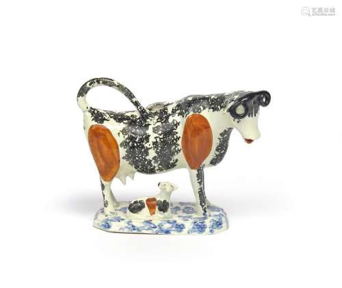 A Staffordshire pearlware cow creamer and cover c.1800, standing four square on a chamfered