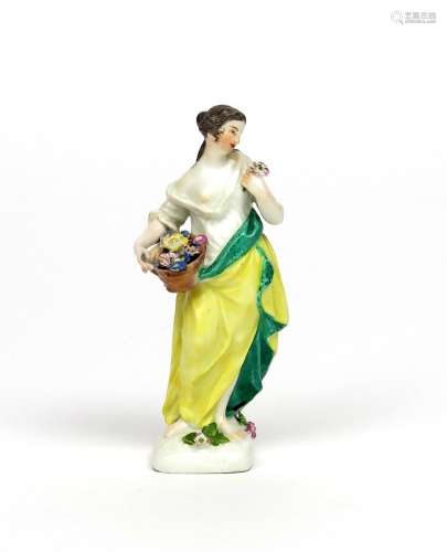A small Meissen figure of a lady mid 18th century, allegorical of Spring, wearing Classical dress