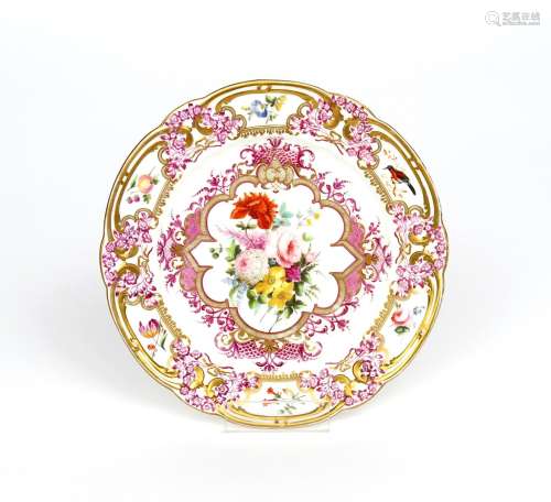 A Nantgarw cabinet plate c.1815-20, decorated in London with a spray of flowers contained in an
