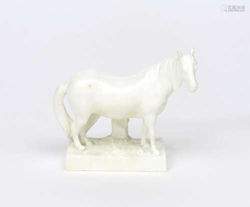 A rare Derby figure of a horse c.1800, standing four square on a textured rectangular base, his ears