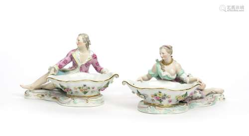 A large pair of Meissen sweetmeat figures 19th century, each modelled with a figure reclining and
