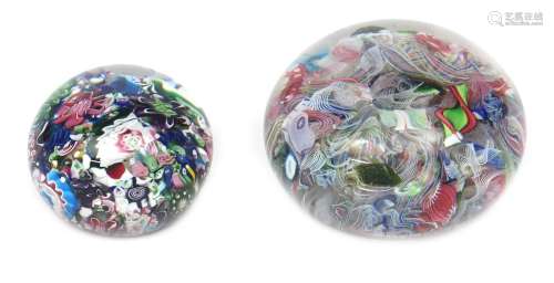 Two French scramble paperweights c.1850, the larger St Louis and set with a jumble of canes and