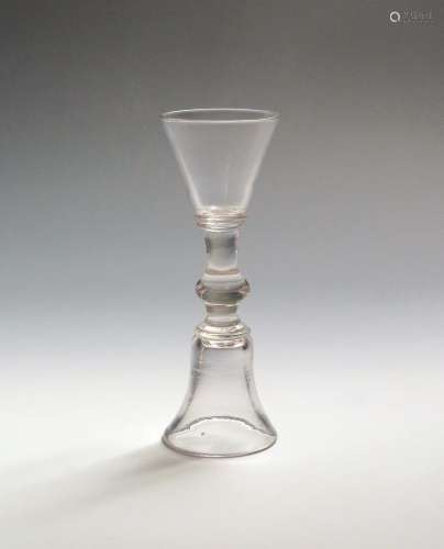 An unusual double-ended wine glass c.1730-50, one end with a bell bowl, the other with a rounded