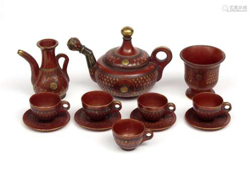 A Tophane pottery part tea service late 19th century, Turkey, the polished ground incised with a