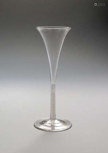 A toasting glass c.1765, with tall drawn trumpet bowl rising from a finely slender double series