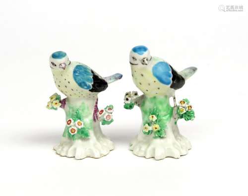 Two Derby figures of blue tits c.1770, each bird perched on a low stump applied with small flowers