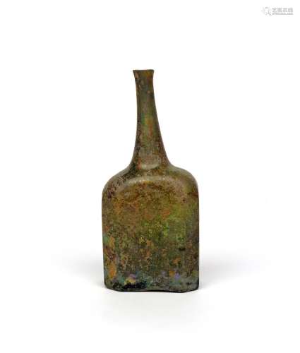 An octagonal wine bottle 18th century, the flattened body rising to a tall tapering neck, signs of