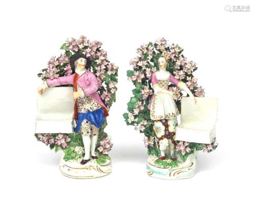 A matched pair of Derby sweetmeat figures c.1760-65, modelled as a young man and his companion