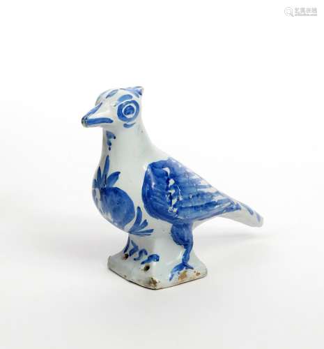 A Nevers faïence bird finial dated 1751, modelled as a large pigeon with plumage picked out in blue,