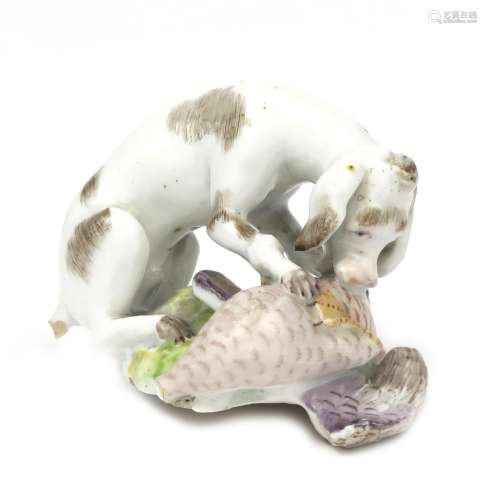 A German porcelain figure of a dog 18th century, his forepaws and muzzle on a dead goose before him,