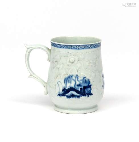 A Philip Christian (Liverpool) blue and white mug c.1765-72, finely moulded with flowering
