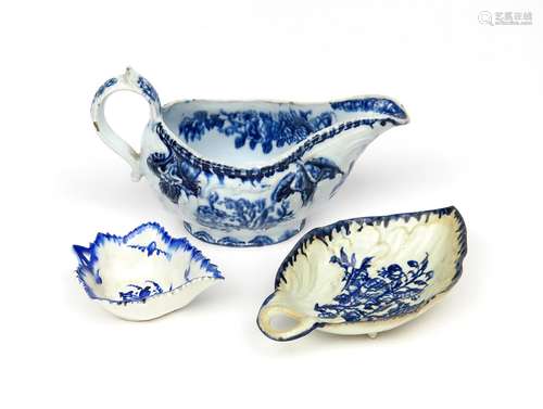 A Derby blue and white sauceboat c.1770-80, moulded with rococo panels between fruit and flower