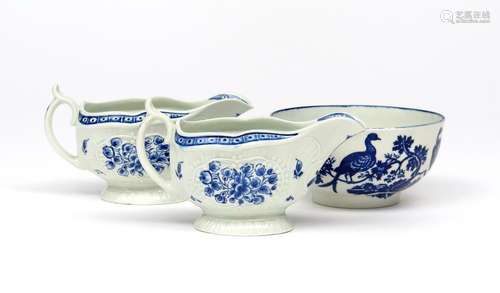 A pair of Worcester blue and white sauceboats c.1775, moulded and painted with the Strap Flute