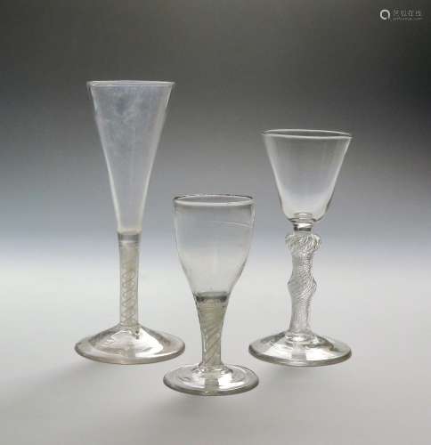Three wine glasses c.1760-70, one with a rounded funnel bowl raised on a double knopped airtwist