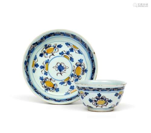 A rare delftware teabowl and saucer c.1750, finely potted and painted in yellow, blue and