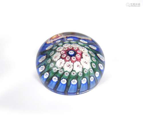 A Russian glass millefiori paperweight 19th century, enclosing concentric circles of varied coloured