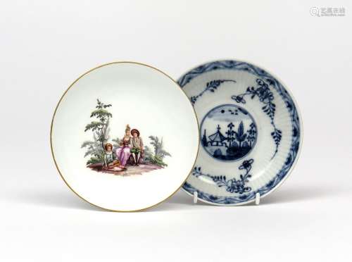Two Meissen saucers c.1730-40, one painted in polychrome enamels with a couple seated on a rocky