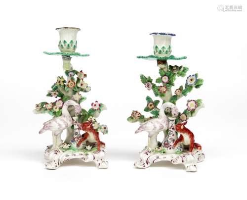 Two Bow Fable candlesticks c.1758, of the Fox and the Stork, the latter with its beak inside the