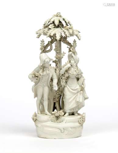 An Italian pealware figure group 19th century, modelled as a couple standing beneath a leafy arbour,