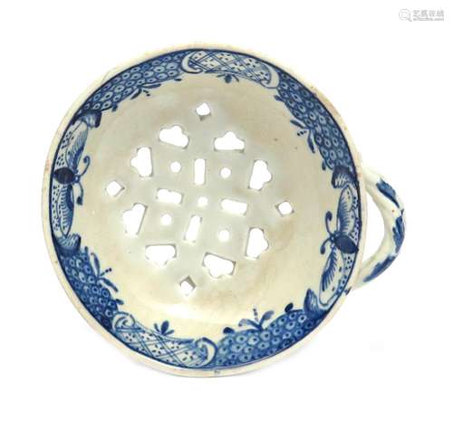 A rare Lowestoft blue and white egg drainer c.1775, the circular form painted with a version of