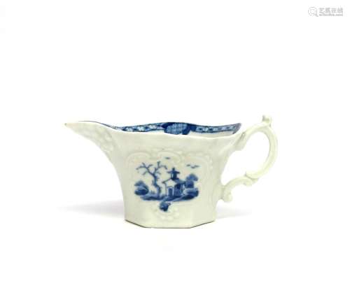 A Worcester blue and white creamboat c.1760, of hexagonal form, moulded with a geranium leaf beneath