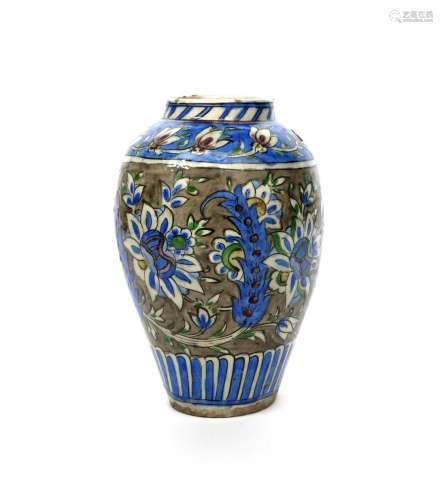 A Qajar pottery vase c.1860, the ovoid form decorated in the Iznik manner with bold saz leaves and