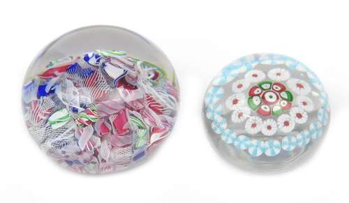 Two Baccarat paperweights c.1850, the larger a scramble weight and set with a jumble of canes and