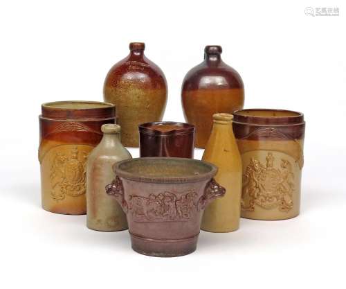 Five brown stoneware jugs or flagons 19th century, of varying plain form, one flagon impressed 'W
