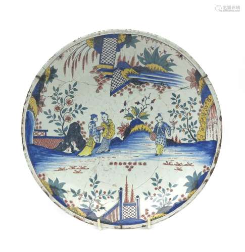 A Rouen faïence saucer dish c.1730-40, well painted in polychrome enamels with Chinese figures in