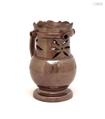 A Nottingham brown stoneware puzzle jug c.1780, the neck pierced with stylized flowerhead designs