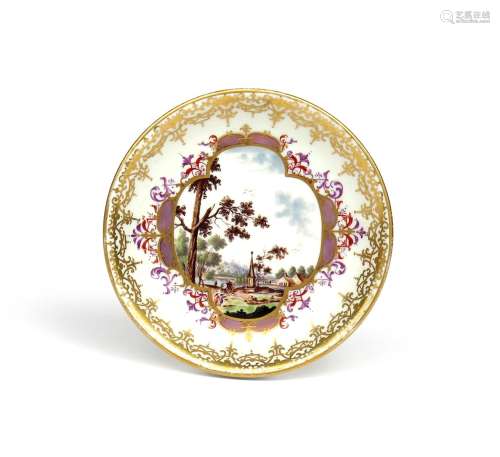 A good Meissen saucer c.1725, painted with a quatrefoil panel of figures on a track beside an
