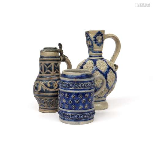 Two Westerwald stoneware jugs 18th/early 19th century, the larger applied to the rounded body with a