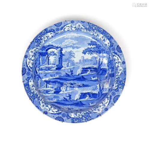 A massive Spode blue and white transferware circular charger or meat dish 19th century, printed in