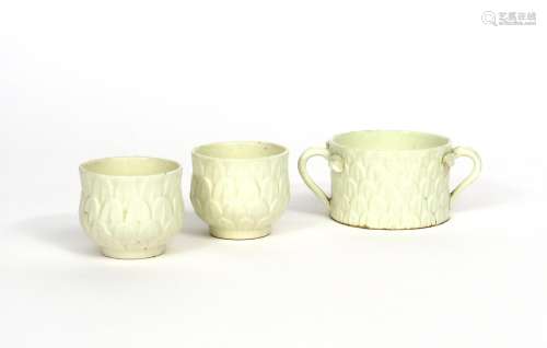Three white-glazed St Cloud pots or cups c.1730-40, two of thistle shape, one straight sided and