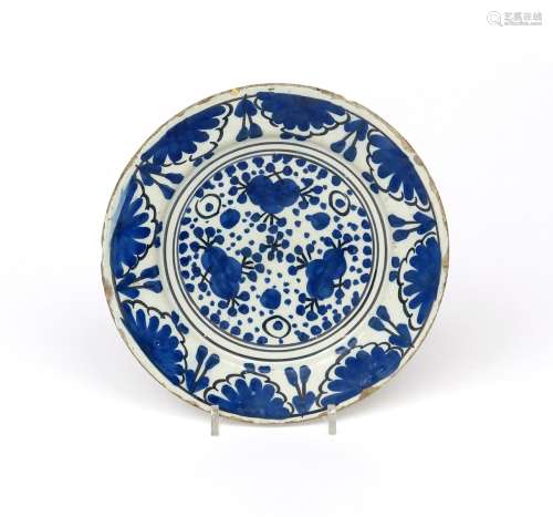 A rare London delftware small plate late 17th century, simply decorated in blue and black with