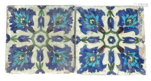 A pair of Qajar large square tiles 19th century, decorated in the Iznik manner with formal floral