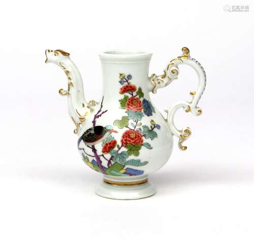 A Meissen hot water jug c.1740, painted with a large bird perched on a flowering branch which