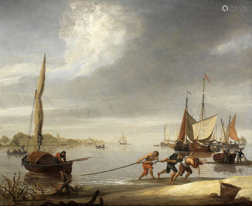 A coastal scene with figures pulling a boat ashore John Thomas Serres(London 1759-1825)