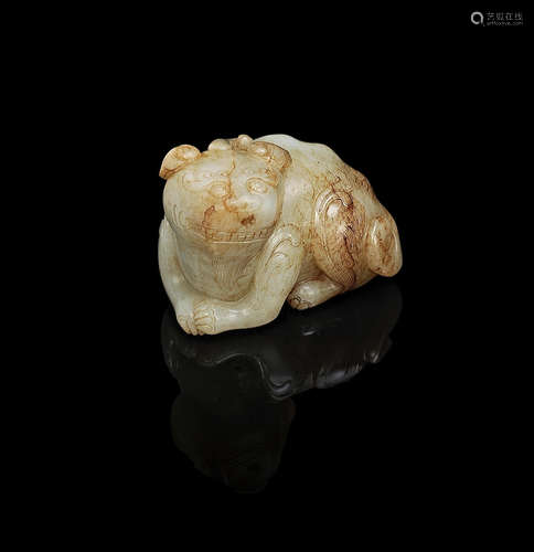 Qing Dynasty A green and russet jade carving of a mythical beast