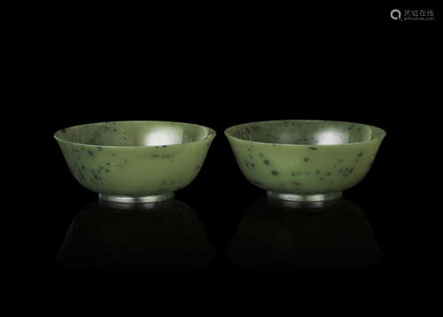 A pair of green hardstone bowls